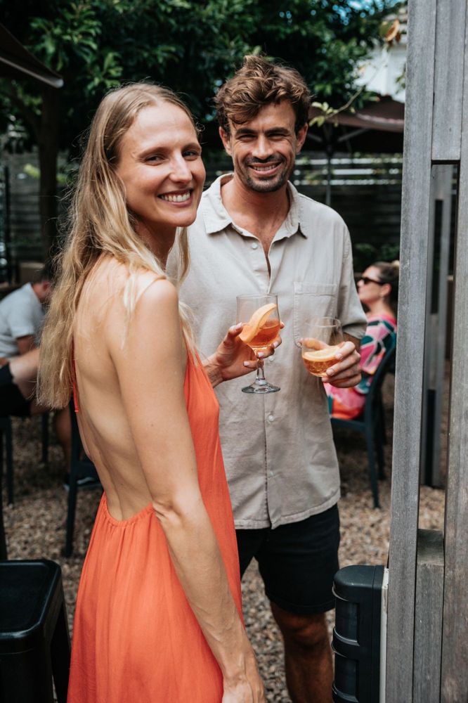 Mia and Paul with spritzes in a garden